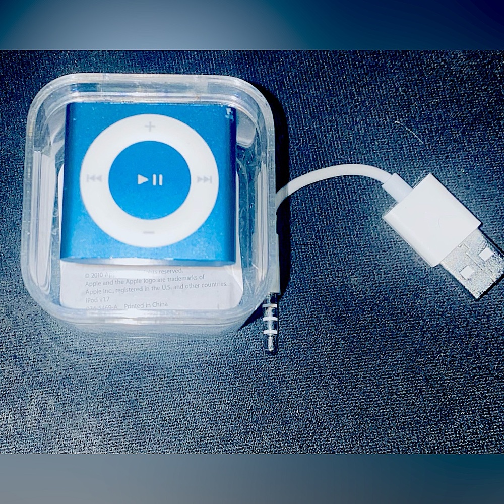 Apple iPod Shuffle 4th Generation 2GB Blue. Comes with cord. Works Great
